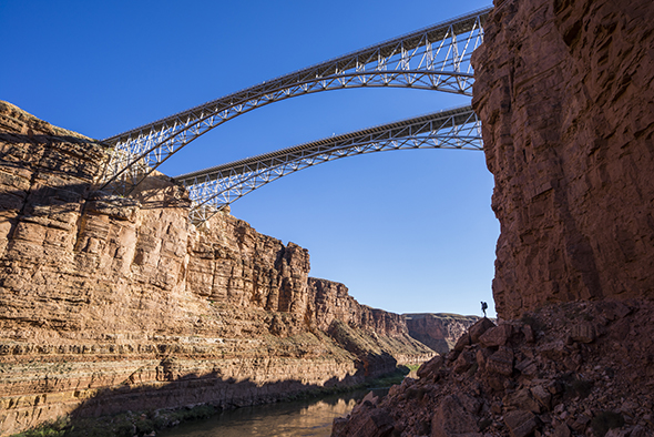 Kevin Fedarko stands below Navajo Brige inside Marble Canyon on day one while walking the length of the Grand Canyon—over 277 river miles and estimated 600 walking.