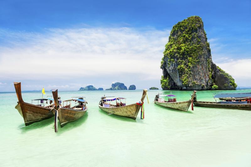 Take a ride on a wooden fishing boat to explore Phuket's beaches.