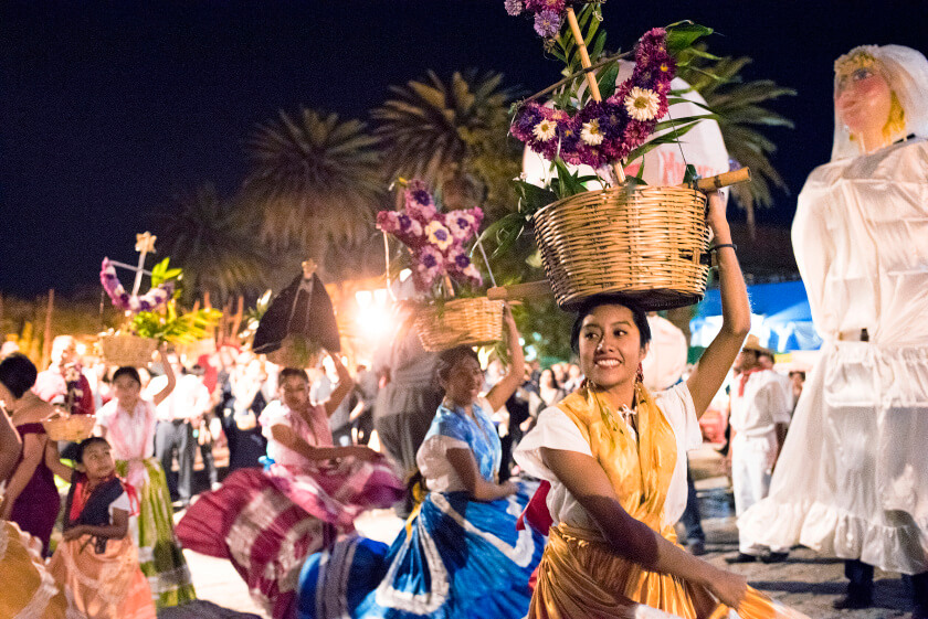 A wedding procession goest through the streets of Oaxaca City.