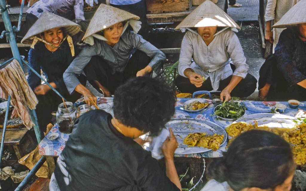 Busy with mid-day shoppers at the My Tho market in Dinh Tuong Province, Vietnam, in 1969.