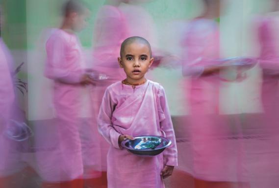 Nuns lining up for their daily meal in a Yangon nunnery