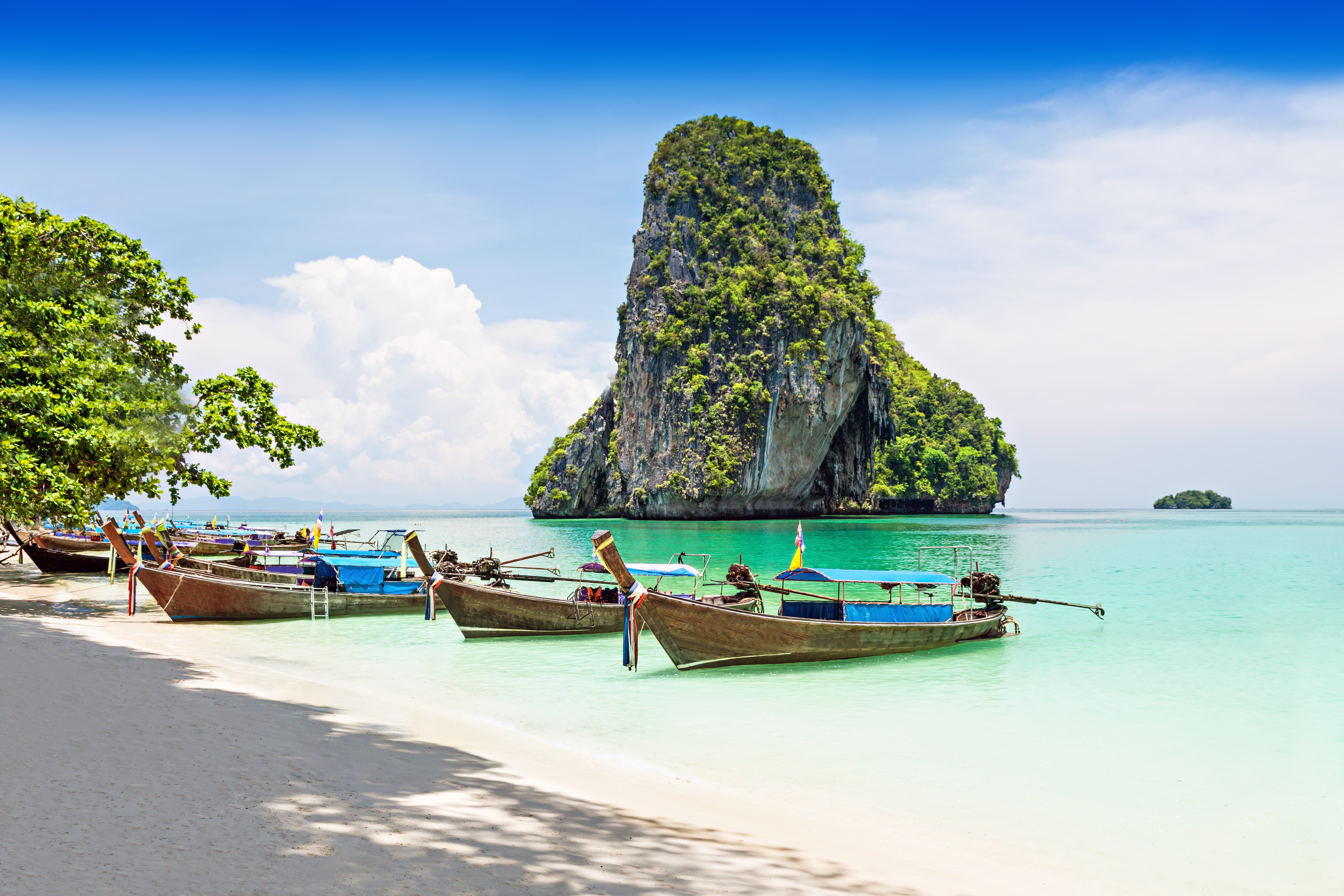 Take a ride on a wooden fishing boat to explore Phuket’s beaches