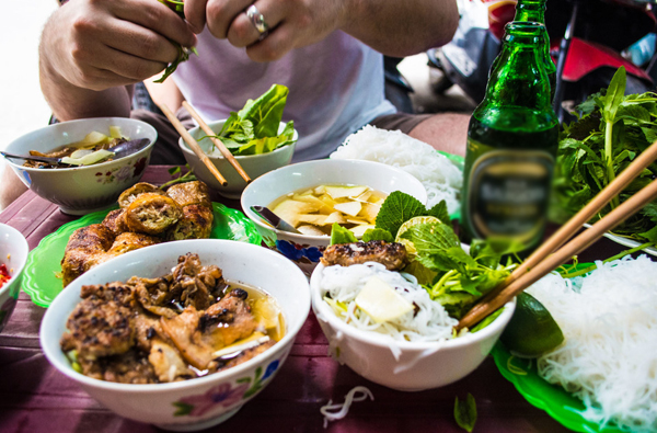 noodles with marinated char-grilled pork and egg rolls