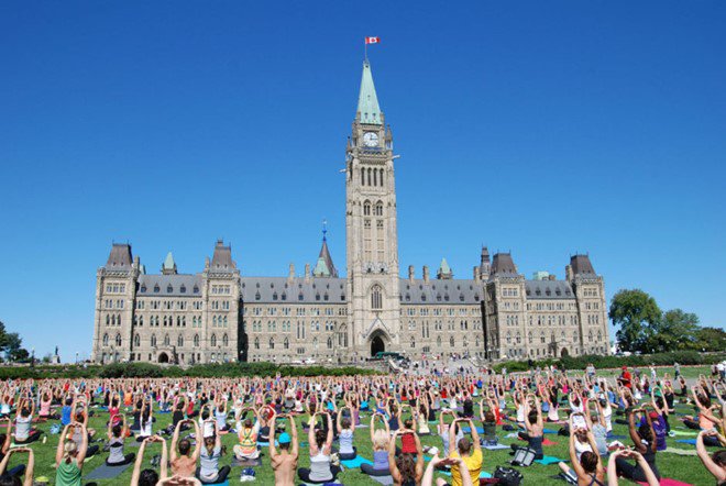Parliament Hill Ottawa yoga on lawn