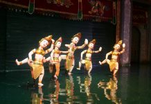 watching water puppet show vietnam travel