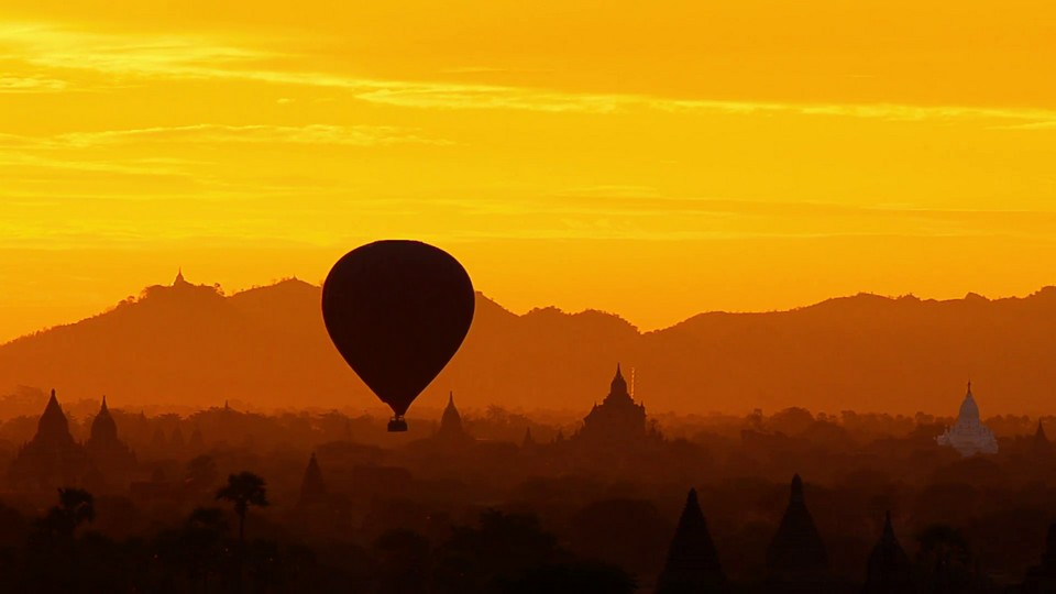 Hot air balloons over ancient temples in Bagan at dawn, Mandalay, Myanmar