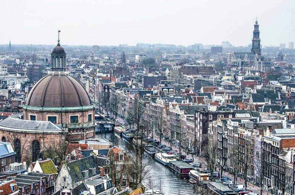 Aerial view of the old center of Amsterdam including the Singel canal, the dome of