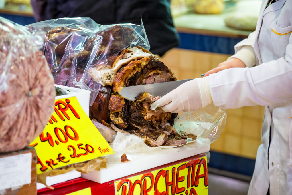 Slicing porchetta in a Rome market