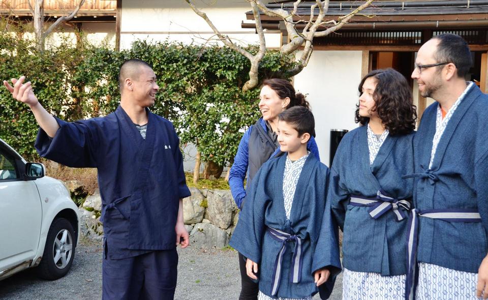 A monk at Ekoin attends to foreign visitors.