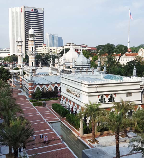 From the train, you can see the beautiful white Masjid Jamek mosque right below.