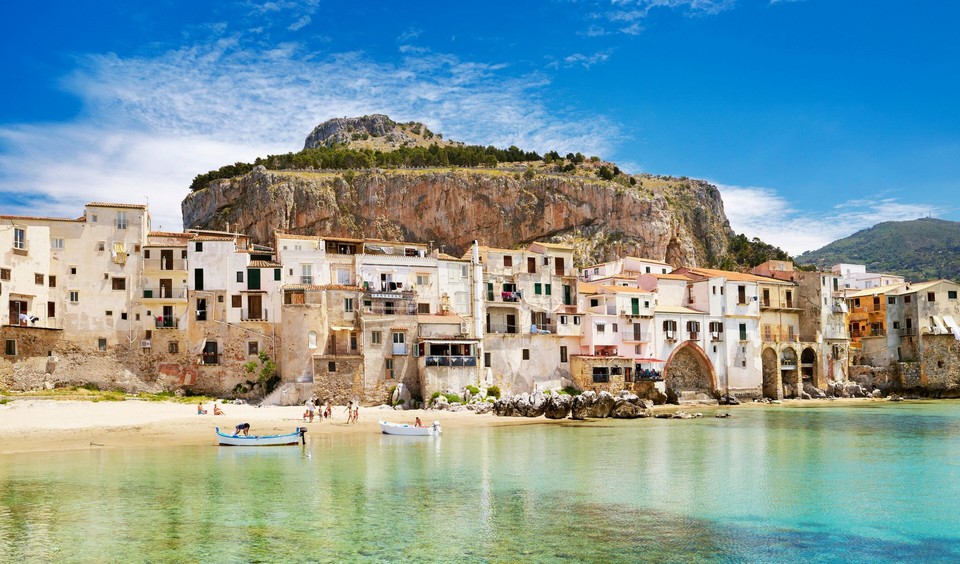 _Medieval_houses_and_La_Rocca_hill_Cefalu_old_town_Sicily_Italy